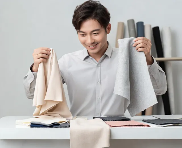 Material advisor comparing fabric handfeel and drape